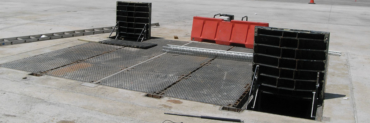  ERMATIC custom modular cover installed at an airport shown with two covers open 