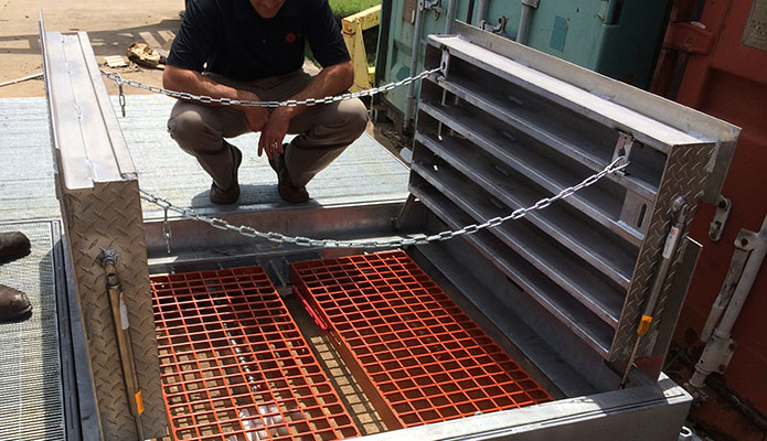 Aluminum fabricated hatch open with safety chains and safe hatch grates